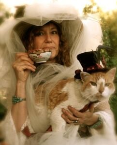 blog 01-photo 06__woman-sipping-tea-with-orange-cat-my-mad-catter “the “My Mad Catter, “Tiger”, and me”